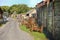 Traditional old farm, with rusty old agricultural equipment and derelict run down farm buildings