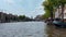 Traditional old narrow houses boats and canals Amsterdam, Netherlands, Europe, July 5 2023