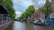 Traditional old narrow houses boats and canals Amsterdam, Netherlands, Europe, July 5 2023