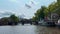 Traditional old narrow houses boats and canals Amsterdam, Netherlands, Europe, July 5 2023