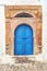 Traditional old painted door in a historical district or medina, Tunisia.