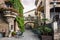 Traditional old Spanish street with beautiful balconies and arches in Barcelona town, Spain