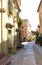 traditional old spanish street with brick wall houses.