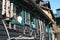 Traditional old wooden austrian house in the city of Hallstatt, Austria. Window, agricultural tools on a wooden wall. Travel