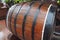 A traditional old wooden barrel with curved walls and metal hoops. Dishes for the ripening of alcoholic beverages - mead