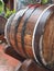 A traditional old wooden barrel with curved walls and metal hoops. Dishes for the ripening of alcoholic beverages - mead