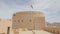 Traditional Omani fortress, general plan and details, a flag on the main tower.