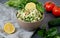 Traditional oriental salad Tabouleh with couscous or bulgur on adark concrete background