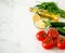 Traditional oriental salad Tabouleh with couscous or bulgur on a white marbled background. Ingredients for the salad: dill,