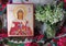 Traditional orthodox icon of St. Barbara. Handwritten icon on the background of Ukrainian rushnyks and lilies of the