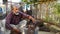 Traditional Outdoor Cooking - Indian Man Roasting Eggplant Over Open Fire