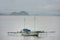 Traditional outrigger boat anchored at Labuan Bajo town on Flores Island, Nusa Tenggara, Indonesia