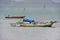 Traditional outrigger boat anchored at Labuan Bajo town on Flores Island, Nusa Tenggara, Indonesia