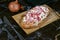 Traditional oval shaped food `Tarte Flambee` or `Flammkuchen` from German-French Alsace border region.