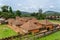 Traditional palace of the Fon of Bafut with brick and tile buildings and jungle environment, Cameroon, Africa