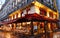 Traditional Parisian cafe in rainy evening, Paris