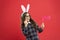 Traditional party activities. Smart bunny. Eyewear booth props. Little cute bunny. Having fun. Girl in Easter bunny at