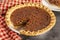 A Traditional Pecan Pie with a Slice Cut Out