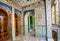 Traditional Persian design of the palace Golestan with painted walls, tiles and wooden doors