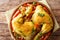 Traditional Persian saffron chicken served with steamed vegetables close-up. Horizontal top view