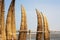 Traditional Peruvian small Reed Boats (Caballitos de Totora), straw boats still used by local fishermens in Peru