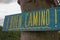 Traditional pilgrim`s sign on the Way of Saint James to Santiago de Compostela, Spain. Wooden vintage board `Buen Camino`.