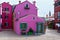 Traditional pink, bordeau and purple houses in Burano, Venice, Italy