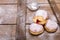 Traditional Polish donuts on wooden background.