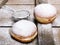 Traditional Polish donuts on wooden background.