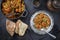 Traditional Polish kraut stew bigos with sausage, meat and mushrooms in a cast iron pot and pewter plate