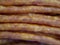 Traditional Polish sausages kabana, close-up shot, full frame. Kabanos, also known as cabanossi or kabana, is a long, thin, dry