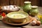 Traditional Polish sour soup Zurek in ceramic bowl on rustic wooden background