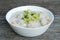 Traditional porridge rice with pork in white bowl.