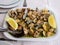 Traditional Portuguese dish, Clams with garlic, extra virgin olive oil and lemon