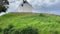 A traditional Portuguese windmill near the Algarve town of Odeceixe, Portugal. Panning upwards shot