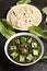 Traditional Punjabi Palak paneer dish served with roti.