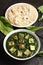 Traditional Punjabi Palak paneer dish served with roti.