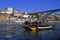 Traditional rabelo boats, Porto city skyline, Douro river and and Dom Luis or Luiz iron bridge. Porto