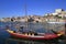 Traditional rabelo boats, Porto city skyline, Douro river and and Dom Luis or Luiz iron bridge. Porto