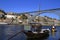 Traditional rabelo boats, Porto city skyline, Douro river and and Dom Luis or Luiz iron bridge. Porto