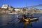 Traditional rabelo boats, Porto city skyline, Douro river and and Dom Luis or Luiz iron bridge. Porto