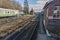 Traditional railway station with rolling stock in a siding