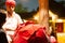 Traditional rajasthani man with a huge pot filled with ice cream kulfi made in the traditional method