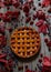 Traditional raspberry pie tart cake sweet baked pastry food on rustic table background. Autumn composition decoration.