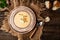 Traditional recipe of Du Barry soup cauliflower in bowl on wooden background, space for text. top view