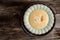 Traditional recipe of Du Barry soup cauliflower in bowl on wooden background, space for text. top view