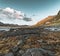 Traditional red fishin house in Bjoernsand near Reine in Lofoten, Norway with red rorbu houses. Sunset afternoon with