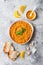 Traditional red lentil Dal. Indian Dhal spicy curry in bowl with flat bread and spices. Top view, overhead.