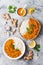 Traditional red lentil Dal. Indian Dhal spicy curry in bowl with flat bread and spices. Top view, overhead.