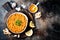 Traditional red lentil Dal. Indian Dhal spicy curry in bowl with flat bread and spices. Top view, overhead.